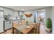Charming eat-in kitchen with modern appliances, wooden table, and gray cabinetry at 101 S 11 Ave, Brighton, CO 80601