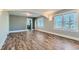 Open-concept living room with hardwood floors, neutral paint and lots of light at 101 S 11 Ave, Brighton, CO 80601