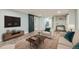 Inviting living room features a barn door, hardwood floors, and comfortable seating at 101 S 11 Ave, Brighton, CO 80601