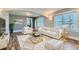 Living room with a neutral color palette, plush white seating, and plenty of natural light at 101 S 11 Ave, Brighton, CO 80601