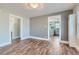 Bright living area featuring hardwood floors and an open view to the kitchen at 101 S 11 Ave, Brighton, CO 80601