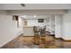 Finished basement with a bar, wood floors, shelving and accent windows at 5735 Big Canon Dr, Greenwood Village, CO 80111
