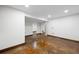 Unfinished basement with stained concrete floors, white painted walls, and arched doorways at 5735 Big Canon Dr, Greenwood Village, CO 80111