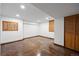 Unfurnished basement featuring stained concrete floors, recessed lighting, and window with shutter at 5735 Big Canon Dr, Greenwood Village, CO 80111