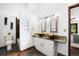 Bathroom featuring double vanity, tile floors, a walk-in shower and a separate water closet at 5735 Big Canon Dr, Greenwood Village, CO 80111
