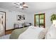 This well-lit bedroom features hardwood floors, and sliding glass door access to the backyard at 5735 Big Canon Dr, Greenwood Village, CO 80111