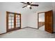 Well-lit bedroom with french doors leading to outdoor views at 5735 Big Canon Dr, Greenwood Village, CO 80111
