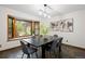 This dining room is bright with a large window and features slate floors and contemporary décor at 5735 Big Canon Dr, Greenwood Village, CO 80111