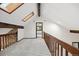 Upstairs hallway with skylights and exposed wood beams at 5735 Big Canon Dr, Greenwood Village, CO 80111