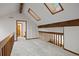 Upstairs hallway with skylights and exposed wood beams at 5735 Big Canon Dr, Greenwood Village, CO 80111