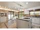 Bright kitchen with stone accent wall, granite countertops, and modern appliances at 5735 Big Canon Dr, Greenwood Village, CO 80111