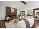 Cozy living room featuring a brick fireplace, vaulted ceiling, and a wet bar area at 5735 Big Canon Dr, Greenwood Village, CO 80111