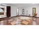 Bright living room with hardwood floors, area rug, and accent chair at 5735 Big Canon Dr, Greenwood Village, CO 80111