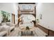 Bright living room with vaulted ceilings, wood accents, and stylish modern furniture at 5735 Big Canon Dr, Greenwood Village, CO 80111