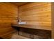Custom-built wooden sauna featuring built-in benches and accessories at 5735 Big Canon Dr, Greenwood Village, CO 80111