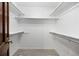 Spacious walk-in closet with ample shelving and hanging space at 5735 Big Canon Dr, Greenwood Village, CO 80111