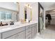 Elegant bathroom with double vanity and a large mirror at 5135 Ditmars Trl, Castle Rock, CO 80104