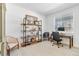 Bright home office features built-in shelving and comfortable seating at 5135 Ditmars Trl, Castle Rock, CO 80104