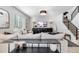 Bright and airy living room with comfortable seating and a modern entertainment center at 5135 Ditmars Trl, Castle Rock, CO 80104