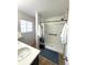 Clean bathroom featuring walk-in shower with subway tiles and dark fixtures at 212 Quari St, Aurora, CO 80011