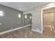 Spacious bedroom with mirrored closet and wood-look floors at 9195 E Lehigh Ave # 151, Denver, CO 80237