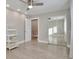 Well-lit bedroom with mirrored closet and wood-look floors at 9195 E Lehigh Ave # 151, Denver, CO 80237