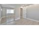 Mirrored closet and wood-look floors in bedroom at 9195 E Lehigh Ave # 151, Denver, CO 80237