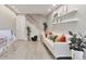 Light-filled living room, featuring a white sofa and stylish decor at 9195 E Lehigh Ave # 151, Denver, CO 80237