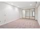 Bedroom featuring carpeted floor and mirrored closet doors at 372 Vance St, Lakewood, CO 80226