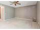 Bedroom featuring neutral walls, carpeted floor, and a ceiling fan at 372 Vance St, Lakewood, CO 80226