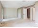 Spacious bedroom featuring large window with a closet and adjacent stairway at 372 Vance St, Lakewood, CO 80226