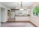 Combined living room and kitchen offer ample space, natural light, and modern updates at 372 Vance St, Lakewood, CO 80226