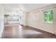 Bright and airy living room with wood floors, a ceiling fan, and adjacent kitchen at 372 Vance St, Lakewood, CO 80226