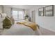 Bright bedroom with large window, comfy bed, and stylish decor at 3319 Belleville Ridge Rd, Elizabeth, CO 80107