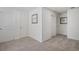 Upstairs hallway with carpet, neutral walls, and two closets at 3319 Belleville Ridge Rd, Elizabeth, CO 80107