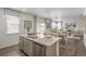 Eat-in kitchen with island, stainless steel appliances, and view of dining room at 3319 Belleville Ridge Rd, Elizabeth, CO 80107