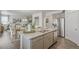 Kitchen with large island, stainless steel appliances, and view into dining area at 3319 Belleville Ridge Rd, Elizabeth, CO 80107