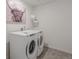 Bright laundry room with side-by-side washer and dryer at 3319 Belleville Ridge Rd, Elizabeth, CO 80107