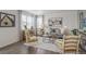 Living room with gray sofa and two armchairs at 3319 Belleville Ridge Rd, Elizabeth, CO 80107