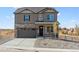 Two-story house with stone and siding accents, a two-car garage, and landscaping at 4607 Cattle Cross Trl, Castle Rock, CO 80104