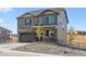 Two-story house with stone and siding accents, a two-car garage, and landscaping at 4607 Cattle Cross Trl, Castle Rock, CO 80104