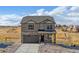 Two-story house with stone and siding accents, a two-car garage, and landscaping at 4607 Cattle Cross Trl, Castle Rock, CO 80104