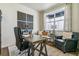 Spacious home office with built-in shelving and large window at 4607 Cattle Cross Trl, Castle Rock, CO 80104