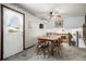 Dining area with wood table and chairs, access to backyard at 13068 Dyanna Dr, Thornton, CO 80241