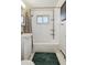 Updated bathroom with white subway tile, a bathtub, and a pedestal sink at 5535 Brentwood St, Arvada, CO 80002