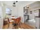 Bright dining area with a round table and four leather chairs near kitchen at 5535 Brentwood St, Arvada, CO 80002