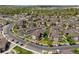 This aerial view shows manicured landscaping, walking paths, and plentiful parking at 12914 Ironstone Way # 102, Parker, CO 80134