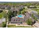 Aerial view of a community with a swimming pool and surrounding green spaces at 12914 Ironstone Way # 102, Parker, CO 80134