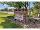 Stone entrance sign to Ironstone at Stroh Ranch surrounded by landscaped greenery, stone and lawn at 12914 Ironstone Way # 102, Parker, CO 80134