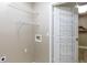 Laundry room featuring wire shelving for storage and a door with additional basket storage at 12914 Ironstone Way # 102, Parker, CO 80134